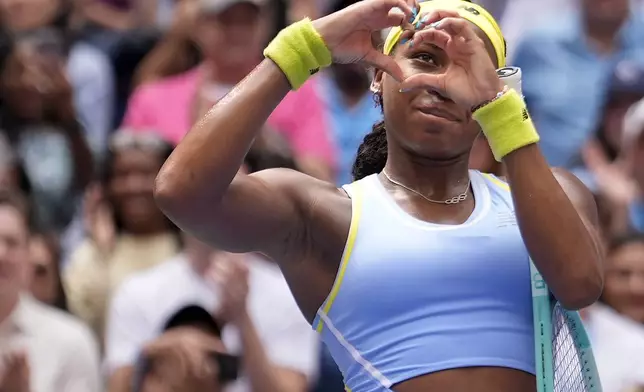 Coco Gauff, of the United States, motions to the crowd after defeating Elina Svitolina, of Ukraine, during the third round of the U.S. Open tennis championships, Friday, Aug. 30, 2024, in New York. (AP Photo/Seth Wenig)