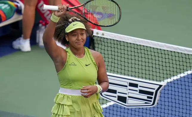 Naomi Osaka, of Japan, waves to spectators after defeating Jelena Ostapenko, of Latvia, during the first round of the U.S. Open tennis championships, Tuesday, Aug. 27, 2024, in New York. (AP Photo/Seth Wenig)