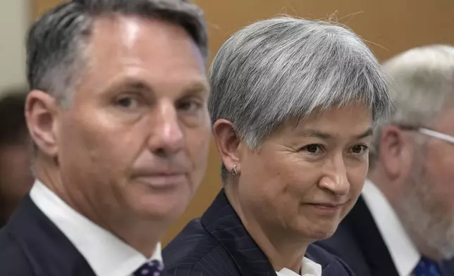 Australia's Foreign Minister Penny Wong, right, and Australia's Deputy Prime Minister and Defense Minister Richard Marles, left, listen during a meeting with Defense Secretary Lloyd Austin and Secretary of State Antony Blinken at the Unites States Naval Academy in Annapolis, Md., Tuesday, Aug. 6, 2024. (AP Photo/Susan Walsh)