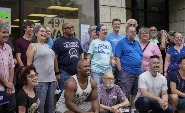 Illinois Rep. Kelly Cassidy, center, meets with volunteers as Democrats plan canvassing efforts in Wisconsin and Michigan as part of "Operation Swing State," Sunday, July 28, 2024, in Chicago. (AP Photo/Erin Hooley)