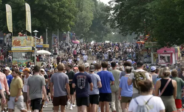 Crowds make their way through the Minnesota State Fair in Falcon Heights, Minn., on Monday, Aug. 26, 2024. (AP Photo/Mark Vancleave)