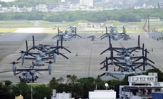 FILE - U.S. MV-22B Osprey transport aircraft are parked at the U.S. Marine Corps Air Station Futenma in Ginowan, south of Okinawa, southern Japan, Wednesday, Sept. 6, 2023. (AP Photo/Hiro Komae, File)