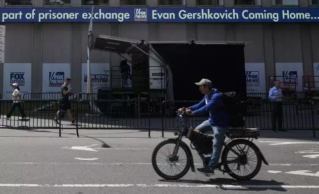 The top news the day is displayed on a ticker outside the headquarters of The Wall Street Journal in New York, Thursday, Aug. 1, 2024. The United States and Russia have completed a 24-person prisoner swap on Thursday, the largest in post-Soviet history, with Moscow releasing journalist Evan Gershkovich and fellow American Paul Whelan in a multinational deal that set some two dozen people free. (AP Photo/Seth Wenig)