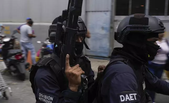 Police on a motorcycle leave the Boleita National Police detention center where some people arrested during recent opposition protests against the official results of the presidential election are held in Caracas, Venezuela, Thursday, Aug. 1, 2024. (AP Photo/Matias Delacroix)