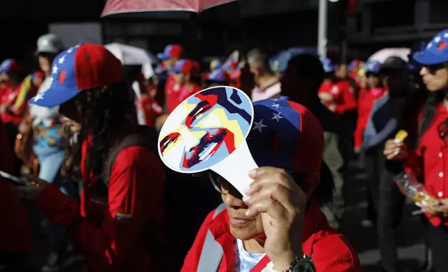 Government supporters rally in defense of President Nicolas Maduro's reelection in Caracas, Venezuela, Wednesday, July 31, 2024, three days after the country's disputed presidential election. (AP Photo/Cristian Hernandez)