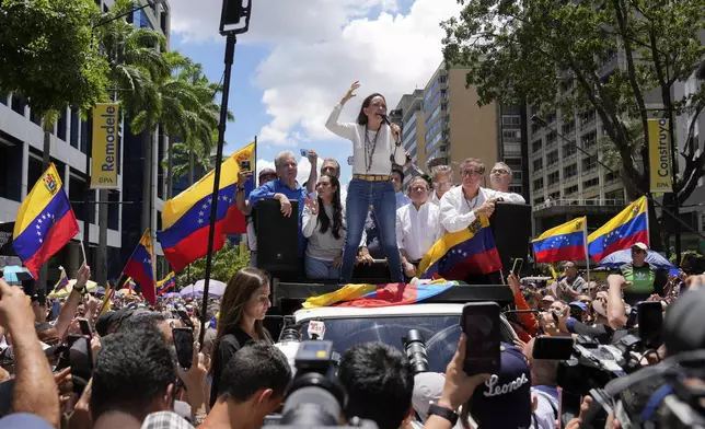 Maria Corina Machado leads a protest against the reelection of President Nicolás Maduro one month after the disputed presidential vote which she claims the opposition won by a landslide, in Caracas, Venezuela, Wednesday, Aug. 28, 2024. (AP Photo/Ariana Cubillos)