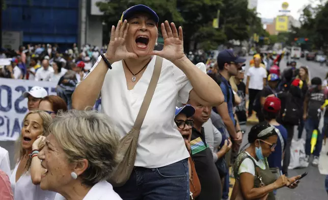 Opposition supporters protest the reelection of President Nicolás Maduro one month after the disputed vote, which opposition leaders claim they won by a landslide, in Caracas, Venezuela, Wednesday, Aug. 28, 2024. (AP Photo/Cristian Hernandez)