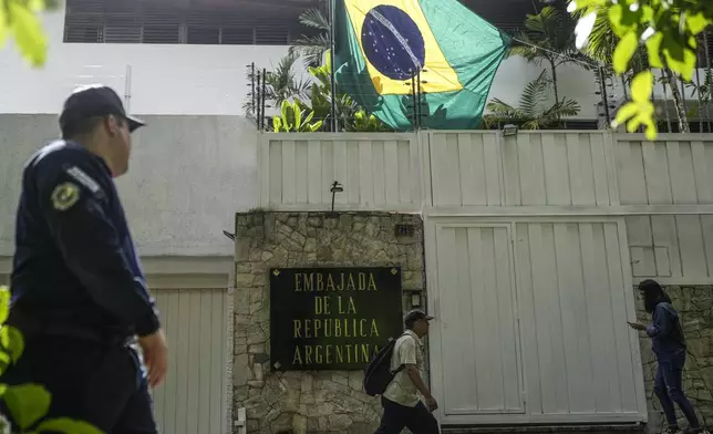 Brazil's flag flies at Argentina's embassy in Caracas, Venezuela, Thursday, Aug. 1, 2024. Argentina announced that Brazil will guard its embassy after the Venezuelan government ordered its diplomatic personnel to leave the country after Argentina's government questioned the transparency of the Venezuelan presidential election results. (AP Photo/Matias Delacroix)