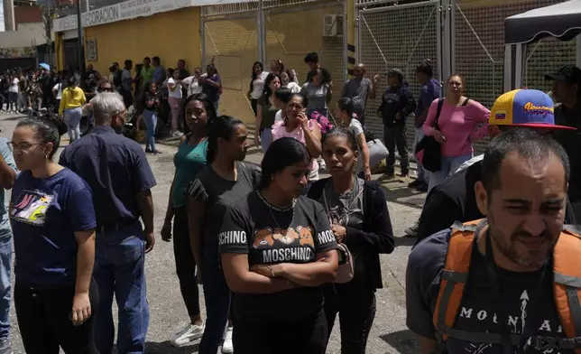 Detainees' families gather outside the Boleita National Police detention center after their loved ones were detained in recent days during opposition protests against the official results of the presidential election in Caracas, Venezuela, Thursday, Aug. 1, 2024. (AP Photo/Matias Delacroix)