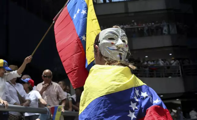 Opposition supporters protest the reelection of President Nicolás Maduro one month after the disputed vote, which opposition leaders claim they won by a landslide, in Caracas, Venezuela, Wednesday, Aug. 28, 2024. (AP Photo/Cristian Hernandez)