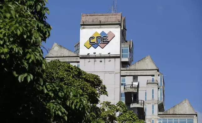 The sun shines down on the National Electoral Council building in Caracas, Venezuela, Wednesday, July 31, 2024, three days after the country's presidential election. (AP Photo/Cristian Hernandez)