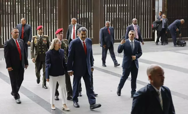 Venezuelan President Nicolas Maduro and his wife Cilia Flores arrive at the Supreme Court in Caracas, Venezuela, Friday, Aug. 2, 2024. (AP Photo/Cristian Hernandez)