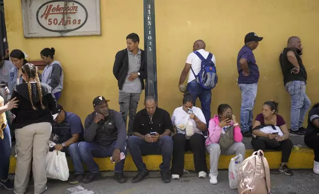 The families of detainees gather outside the Boleita National Police detention center after their loved ones were detained in recent days during opposition protests against the official results of the presidential election in Caracas, Venezuela, Thursday, Aug. 1, 2024. (AP Photo/Matias Delacroix)