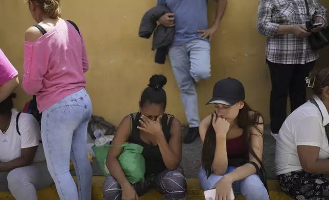 The families of detainees gather outside the Boleita's National Police detention center after their loved ones were detained in recent days during opposition protests against the official results of the presidential election in Caracas, Venezuela, Thursday, Aug. 1, 2024. (AP Photo/Matias Delacroix)