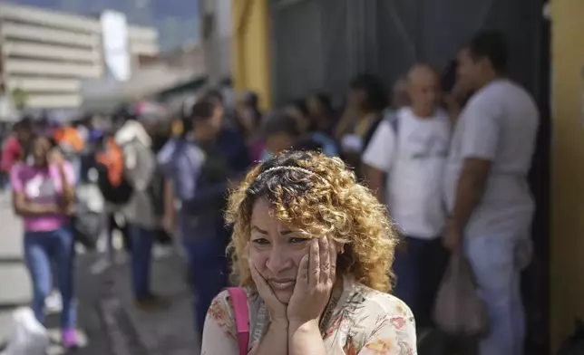 Maritza Fernández stands outside the Boleita National Police detention center after her partner was detained in recent days during opposition protests against the official results of the presidential election in Caracas, Venezuela, Thursday, Aug. 1, 2024. (AP Photo/Matias Delacroix)