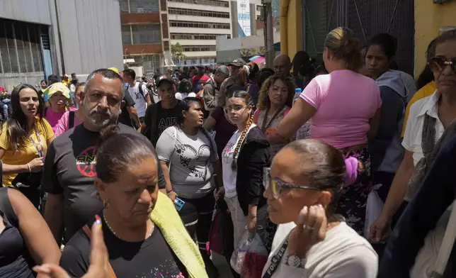 Detainees' families gather outside the Boleita National Police detention center after their loved ones were arrested during opposition protests in recent days against the official results of the presidential election in Caracas, Venezuela, Thursday, Aug. 1, 2024. (AP Photo/Matias Delacroix)