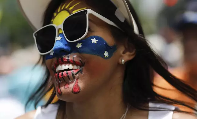 Opposition supporters protest the reelection of President Nicolás Maduro one month after the disputed vote, which opposition leaders claim they won by a landslide, in Caracas, Venezuela, Wednesday, Aug. 28, 2024. (AP Photo/Cristian Hernandez)