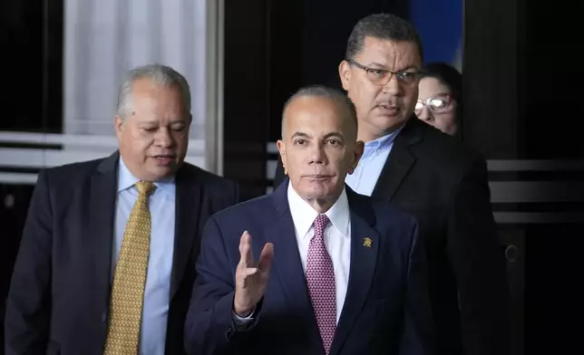 Opposition politicians Manuel Rosales, center, Jose Cartaya, left, and Simon Calzadilla, right, leave the Supreme Court in Caracas, Venezuela, Wednesday, Aug. 7, 2024. The country's high court is conducting an audit of the disputed, July 28 presidential election. (AP Photo/Matias Delacroix)