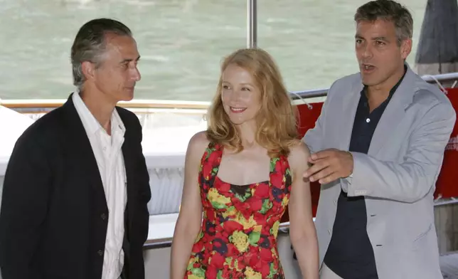 FILE - US actor-director George Clooney, right, US actress Patricia Clarkson, center, and US actor David Strathairn arrive for a press conference to present their movie "Good night, and Good Luck" at the 62nd edition of the Venice Film Festival in Venice, northern Italy on Sept. 1, 2005. (AP Photo/Domenico Stinellis, File)