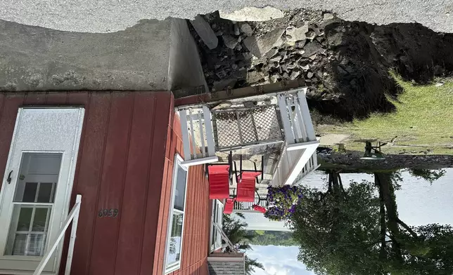 A flood-damaged house is shown Thursday, Aug. 1, 2024, on Seymour Lake in Morgan, Vt. Storms dropped more than 8 inches (20 centimeters) of rain on some northeastern areas of Vermont on Tuesday, July 30, 2024, causing another bout of violent flooding. (AP Photo/Lisa Rathke)