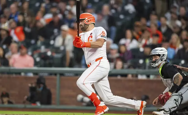 San Francisco Giants' Curt Casali hits during the fifth inning of a baseball game against the Chicago White Sox in San Francisco, Tuesday, Aug. 20, 2024. (AP Photo/Nic Coury)