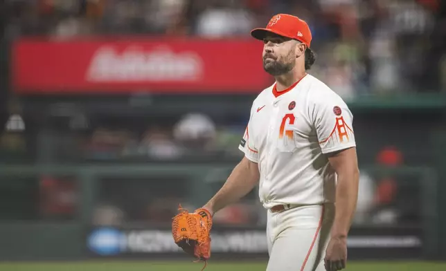 San Francisco Giants pitcher Robbie Ray leaves the game during the seventh inning of a baseball game against the Chicago White Sox in San Francisco, Tuesday, Aug. 20, 2024. (AP Photo/Nic Coury)