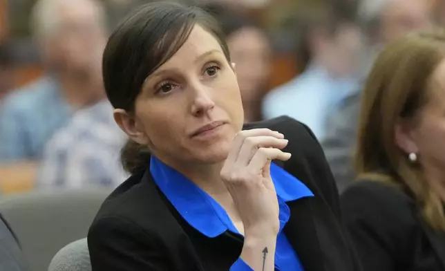 Kouri Richins, a Utah mother of three who wrote a children's book about coping with grief after her husband's death and was later accused of fatally poisoning him, looks on during a courthearing Tuesday, Aug. 27, 2024, in Park City, Utah. (AP Photo/Rick Bowmer, Pool)