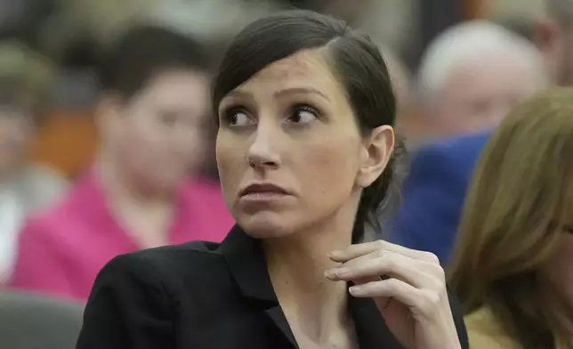 Kouri Richins, a Utah mother of three who wrote a children's book about coping with grief after her husband's death and was later accused of fatally poisoning him, looks on during a hearing Monday, Aug. 26, 2024, in Park City, Utah. (AP Photo/Rick Bowmer, Pool)