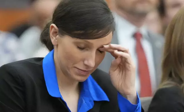 Kouri Richins, a Utah mother of three who wrote a children's book about coping with grief after her husband's death and was later accused of fatally poisoning him, looks on during a hearing Tuesday, Aug. 27, 2024, in Park City, Utah. (AP Photo/Rick Bowmer, Pool)