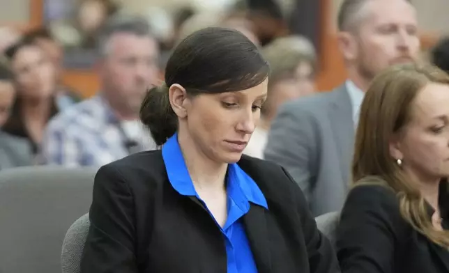 Kouri Richins, a Utah mother of three who wrote a children's book about coping with grief after her husband's death and was later accused of fatally poisoning him, looks on during a hearing Tuesday, Aug. 27, 2024, in Park City, Utah. (AP Photo/Rick Bowmer, Pool)