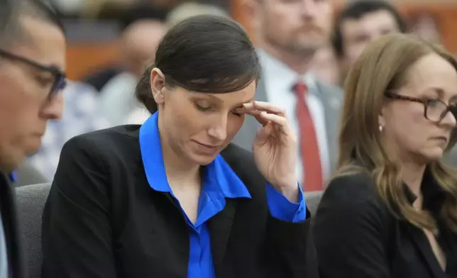 Kouri Richins, a Utah mother of three who wrote a children's book about coping with grief after her husband's death and was later accused of fatally poisoning him, looks on during a hearing Tuesday, Aug. 27, 2024, in Park City, Utah. (AP Photo/Rick Bowmer, Pool)