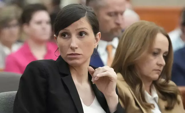 Kouri Richins, a Utah mother of three who wrote a children's book about coping with grief after her husband's death and was later accused of fatally poisoning him, looks on during a hearing Monday, Aug. 26, 2024, in Park City, Utah. (AP Photo/Rick Bowmer, Pool)