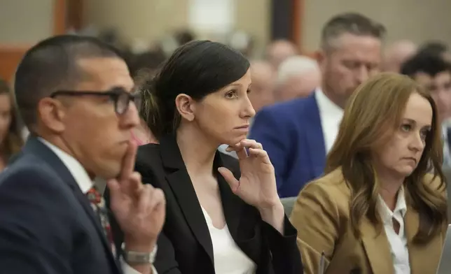 Kouri Richins, a Utah mother of three who wrote a children's book about coping with grief after her husband's death and was later accused of fatally poisoning him, looks on during a hearing Monday, Aug. 26, 2024, in Park City, Utah. (AP Photo/Rick Bowmer, Pool)