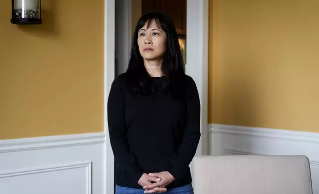 Ellen Lo Hoffman, the co-founder of Soul Reparations, a nonprofit providing free spiritual support to women, poses for a portrait at her home Wednesday, Aug. 21, 2024, in Bothell, Wash. (AP Photo/Lindsey Wasson)