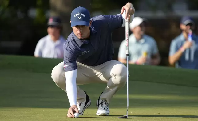 Max Greyserman lines up a putt on the ninth hole during the final round of the Wyndham Championship golf tournament in Greensboro, N.C., Sunday, Aug. 11, 2024. (AP Photo/Chuck Burton)