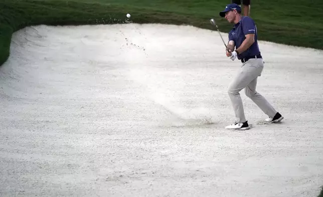 Max Greyserman hits from a sand trap on the 18th hole during the final round of the Wyndham Championship golf tournament in Greensboro, N.C., Sunday, Aug. 11, 2024. (AP Photo/Chuck Burton)