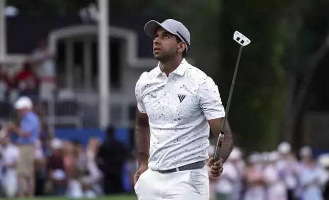 Aaron Rai, of England, reacts on the 18th hole after winning the Wyndham Championship golf tournament in Greensboro, N.C., Sunday, Aug. 11, 2024. (AP Photo/Chuck Burton)