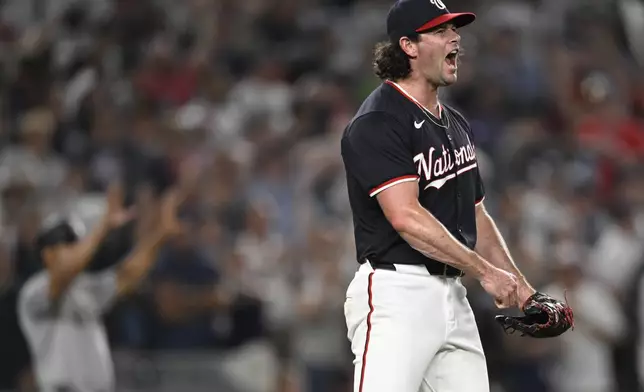 Washington Nationals relief pitcher Kyle Finnegan celebrates the final out of the game during a defeat of the New York Yankees, Tuesday, Aug. 27, 2024, in Washington. (AP Photo/John McDonnell)