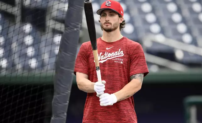 Washington Nationals' Dylan Crews watches during batting practice before a baseball game against the New York Yankees, Monday, Aug. 26, 2024, in Washington. Crews is set to make his major league debut. (AP Photo/Nick Wass)