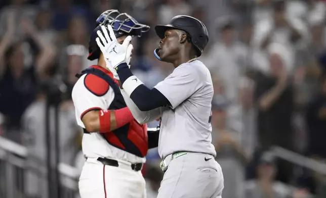 New York Yankees' Jazz Chisholm Jr. celebrates his home run during the eighth inning of a baseball game against the Washington Nationals, Monday, Aug. 26, 2024, in Washington. (AP Photo/Nick Wass)