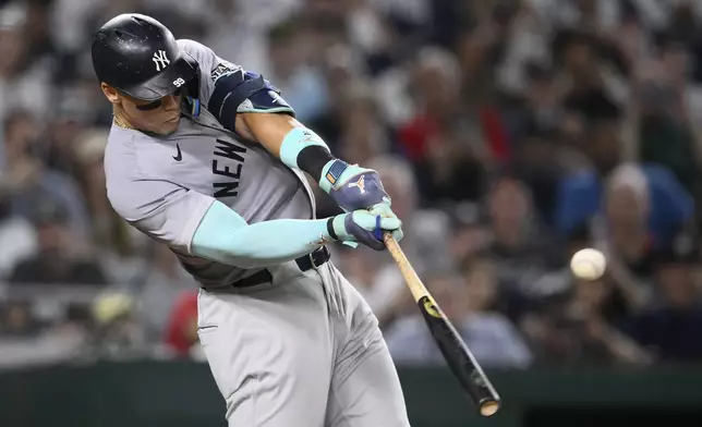 New York Yankees' Aaron Judge singles during the ninth inning of a baseball game against the Washington Nationals, Monday, Aug. 26, 2024, in Washington. (AP Photo/Nick Wass)