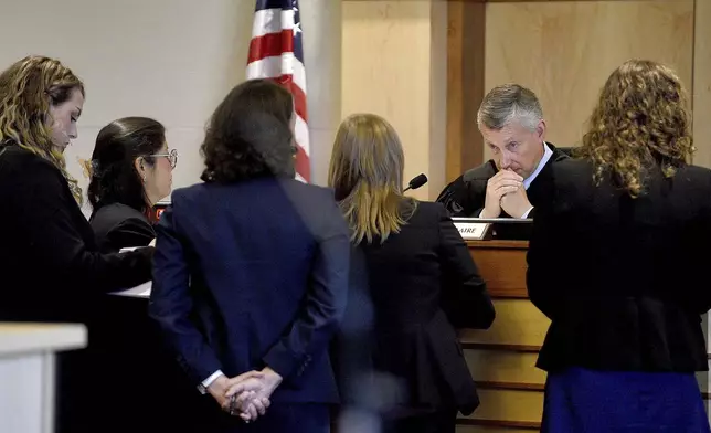 Superior Court Justice Daniel St. Hilaire conducts a bench meeting with lawyers during the first day of the trial for Victor Malavet, 62, of Gilford at Merrimack County Superior Court in Concord, N.H., Monday, Aug. 26, 2024. Malavet is a former state employee charged in connection with the attorney general's probe of the Sununu Youth Services Center in Manchester. (David Lane/Union Leader via AP, Pool)