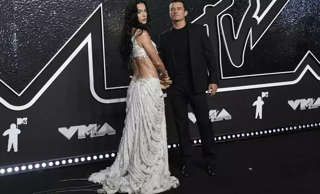 Katy Perry, left, and Orlando Bloom arrive at the MTV Video Music Awards on Wednesday, Sept. 11, 2024, at UBS Arena in Elmont, N.Y. (Photo by Evan Agostini/Invision/AP)