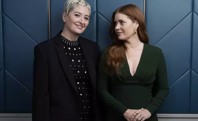 Marielle Heller, left, the writer/director of "Nightbitch," and the film's star Amy Adams pose for a portrait during the Toronto International Film Festival, Sunday, Sept. 8, 2024, in Toronto. (AP Photo/Chris Pizzello)