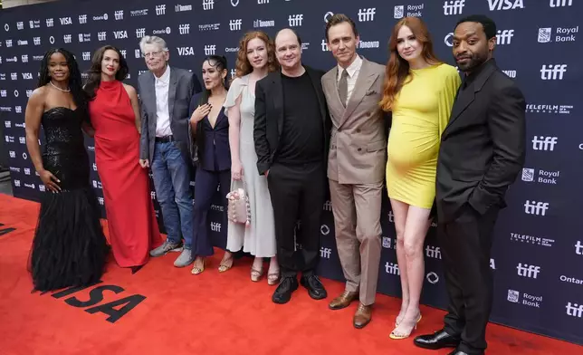 The Pocket Queen, from left, Kate Siegel, Stephen King, Q'orianka Kilcher, Annalise Basso, Mike Flanagan, Tom Hiddleston, Karen Gillan, and Chiwetel Ejiofor attend the premiere of "The Life of Chuck" during the Toronto International Film Festival on Friday, Sept. 6, 2024, at Princess of Wales Theatre in Toronto. (AP Photo/Chris Pizzello)