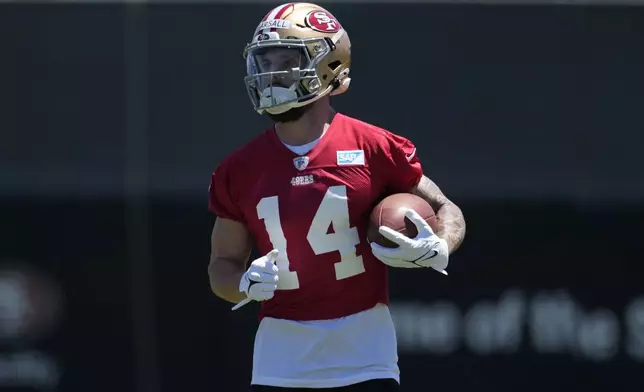 FILE - San Francisco 49ers wide receiver Ricky Pearsall carries the ball during the NFL football team's rookie minicamp in Santa Clara, Calif., May 10, 2024. (AP Photo/Jeff Chiu, File)