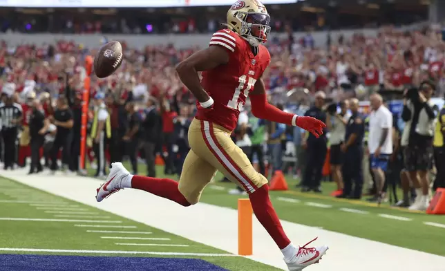 San Francisco 49ers wide receiver Jauan Jennings (15) reacts after scoring against the Los Angeles Rams during the second half of an NFL football game, Sunday, Sept. 22, 2024, in Inglewood, Calif. (AP Photo/Ryan Sun)