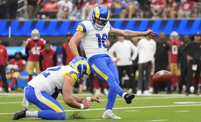 Los Angeles Rams place kicker Joshua Karty (16) kicks a field goal from the hold of Ethan Evans during the second half of an NFL football game, Sunday, Sept. 22, 2024, in Inglewood, Calif. (AP Photo/Ashley Landis)