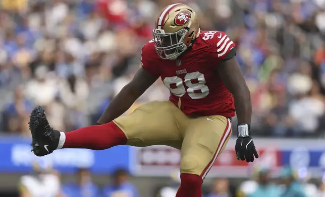 San Francisco 49ers defensive tackle Javon Hargrave (98) celebrates after sacking Los Angeles Rams quarterback Matthew Stafford during the first half of an NFL football game, Sunday, Sept. 22, 2024, in Inglewood, Calif. (AP Photo/Ryan Sun)