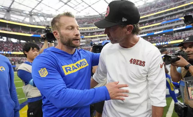 Los Angeles Rams head coach Sean McVay, left, greets San Francisco 49ers head coach Kyle Shanahan after an NFL football game, Sunday, Sept. 22, 2024, in Inglewood, Calif. (AP Photo/Ashley Landis)